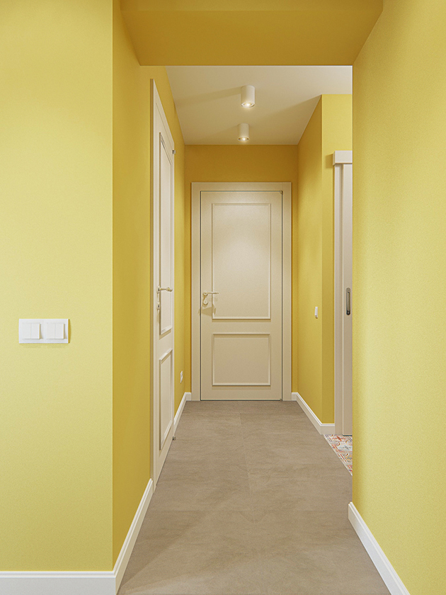 Un pasillo pintado de amarillo