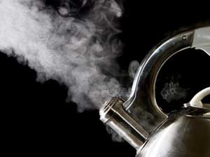 Tea kettle with boiling water